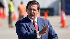 Gov. Ron DeSantis is pictured speaking Wednesday, Jan. 6, 2021, outside Hard Rock Stadium in Miami Gardens.