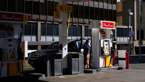A driver waits at a pump at a Shell gas station.