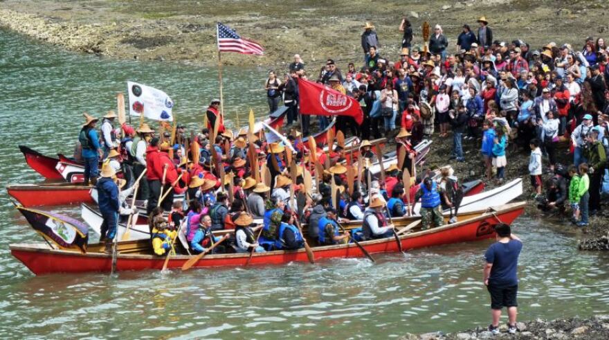 Canoes from around Southeast Alaska are formally greeted at the Douglas Boat Harbor on June 8, 2016, just before that year’s Celebration. This year’s canoes are scheduled to arrive between 2 and 3:30 p.m June 5. They’re organized by the One People Canoe Society. (Photo by Ed Schoenfeld/CoastAlaska News)