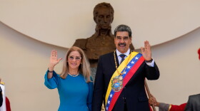 FILE - Venezuelan President Nicolas Maduro and his wife Cilia Flores wave after his swearing-in ceremony for a third term at the National Assembly in Caracas, Venezuela, on Jan. 10, 2025.