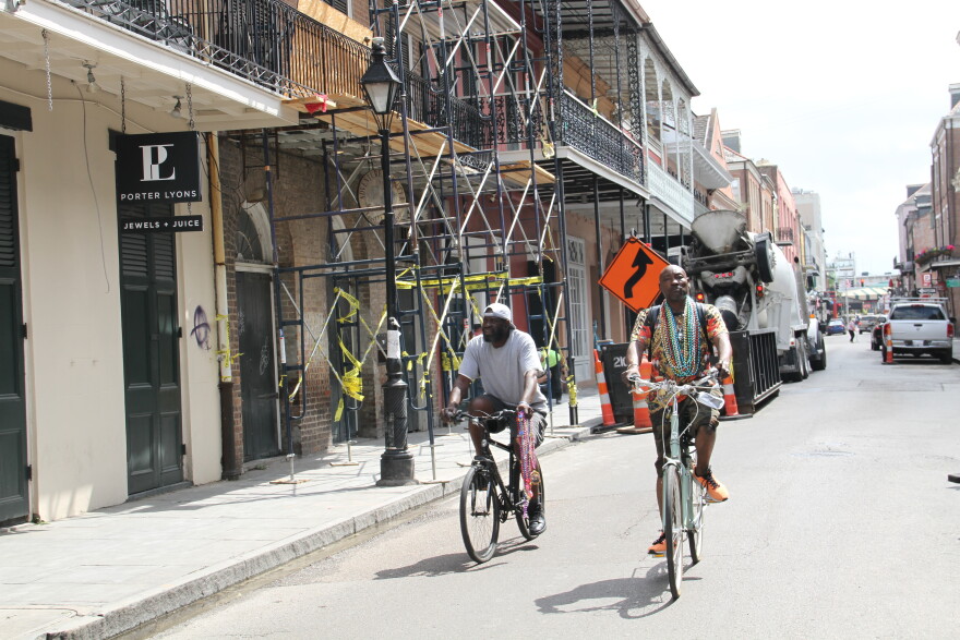 People bike through the French Quarter in quieter times. March 19, 2020.