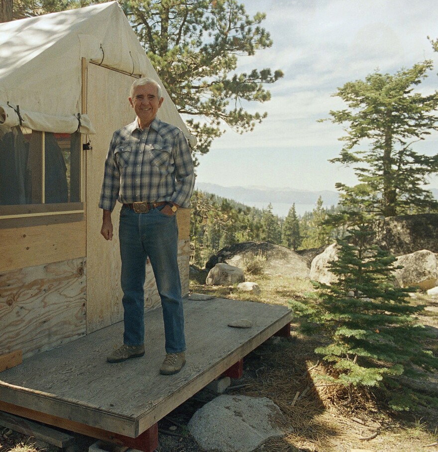Nevada U.S. Senator Paul Laxalt on August 26 1986 in Lake Merlette stands beside one of his tent-cabins at his rustic and isolated Sierra Nevada retreat above Lake Tahoe in his home state where he likes to spend some of his time when not in Washington. (AP Photo/Walt Zeboski)