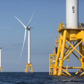 FILE - In this Aug. 15, 2016 file photo, three of Deepwater Wind's five turbines stand in the water off Block Island, R.I, the nation's first offshore wind farm. An offshore wind project off the island of Martha's Vineyard, off the Massachusetts coast, that would create 800 megawatts of electricity, enough to power 400,000 homes, was approved by the federal government Tuesday, May 11, 2021. The Vineyard Wind project, south of Martha's Vineyard near Cape Cod, would be the first utility-scale wind power development in federal waters. (AP Photo/Michael Dwyer, File)