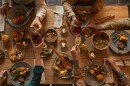 Background of a group of people enjoying a feast during a dinner party with friends and family.