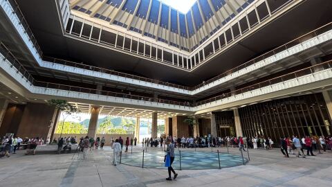 Community members gather in the open-air Hawaiʻi State Capitol courtyard on opening day. (Jan. 15, 2025)