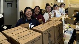 CAFÉ volunteers prepare boxes of supplies for agricultural workers, ensuring community support during extreme weather conditions. Pictured left to right, Yesenia Perez Ana Sanchez, Angelica Garcia-Macias, Joanna Sanchez, and Stephanie Guzman. (Credit: CAFÉ)