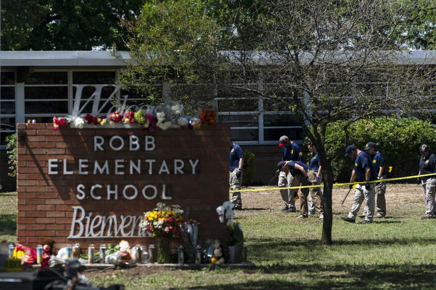 Investigators search for evidence outside Robb Elementary School in Uvalde, Texas, May 25, 2022, after an 18-year-old gunman killed 19 students and two teachers. Four months after the Robb Elementary School shooting, the Uvalde school district on Friday, Oct. 7 pulled its entire embattled campus police force off the job.