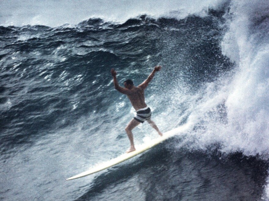 Greg Noll surfing Waimea Bay in Oahu in 1960.