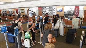 Passengers line up to check their luggage at Chattanooga Airport in June 2022.