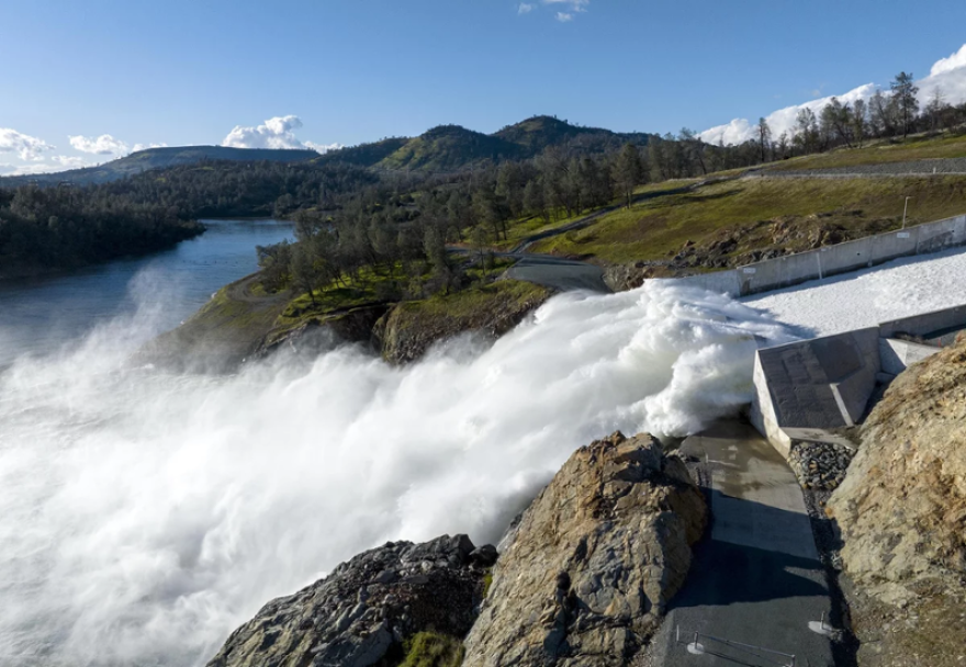 Water pours out of Lake Oroville in Northern California in March. Reservoirs levels plummeted over the last three years, but now have more water than they can hold.