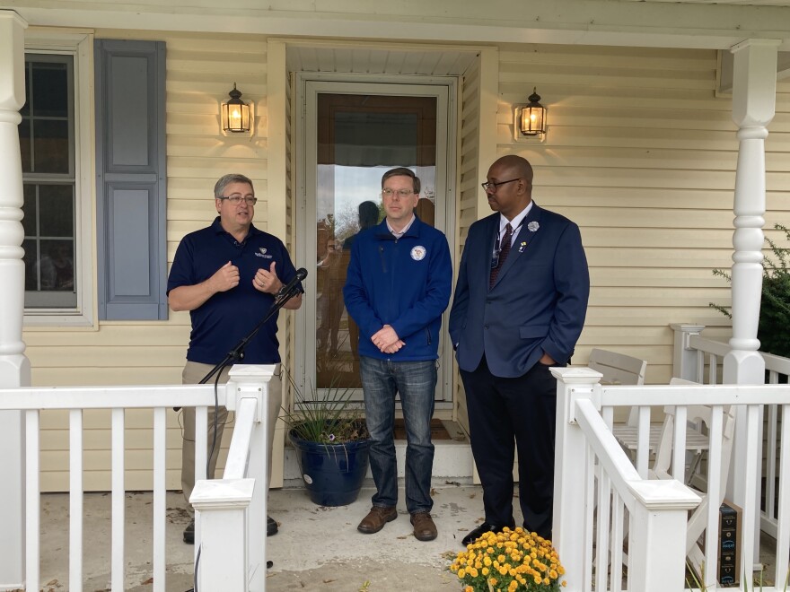 St. Joseph County Department of Health deputy health officer Mark Fox (left) speaks during an Oct. 25 press conference on childhood lead exposure with Mayor James Mueller (center) and 1st District council member Canneth Lee (right).