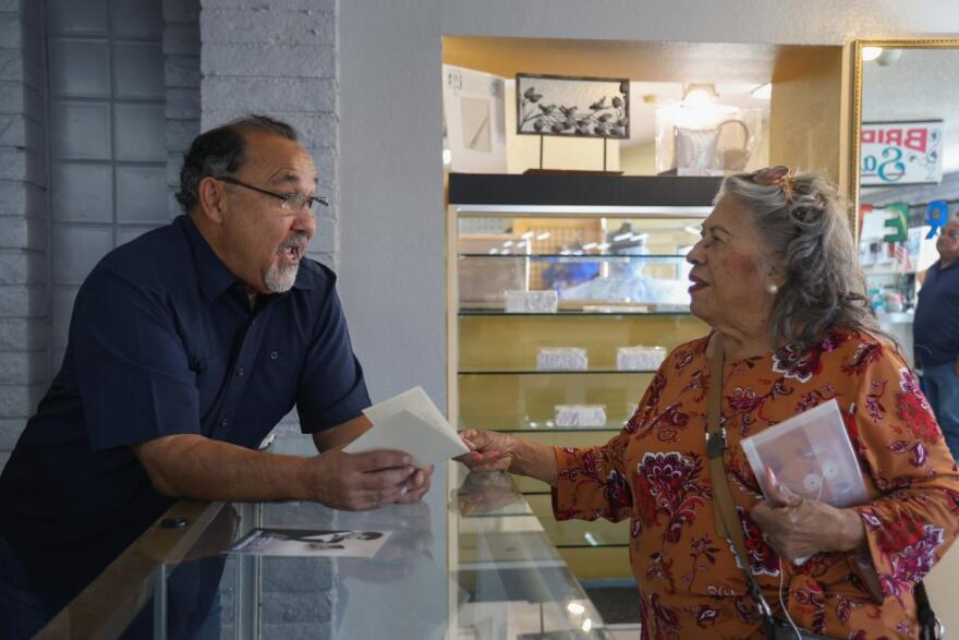 Man and woman talk at counter
