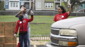 Volunteers for the Central Texas Food Bank distribute food to clients at Linder Elementary School in Austin in March. 