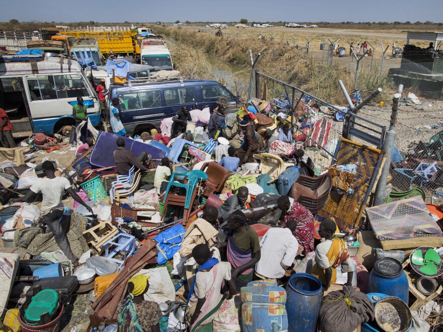 Civilians who fled the recent fighting stack their belongings up outside the gate of the United Nations Mission in South Sudan compound, in the provincial capital of Bentiu, west of Malakal, on Sunday.