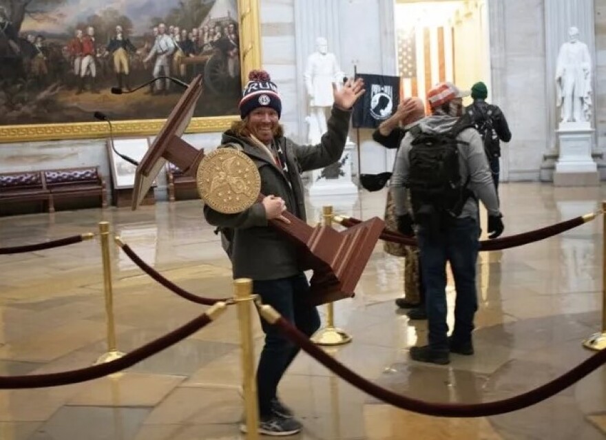 Adam Johnson, photographed with Nancy Pelosi’s lectern during the Jan. 6 Capitol riots, announced he’s running for office in Manatee County. He, along with nearly 1,600 others, were pardoned by President Trump in 2025.