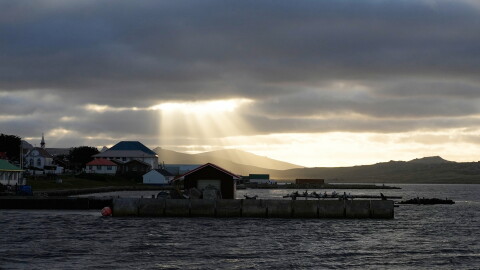FILE - Sunlight breaks through the clouds over Stanley on the Falkland Islands, also known as Islas Malvinas, March 14, 2026.