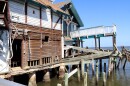 A damaged building sits along the waterfront in Cedar Key, Fla. The structure shows lingering impacts along the shoreline nearly two years after Hurricane Helene.