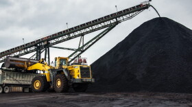 Coal pours off a conveyor belt on the surface of an underground coal mine in Muhlenberg County, Kentucky. (Chris Bentley/Here & Now)