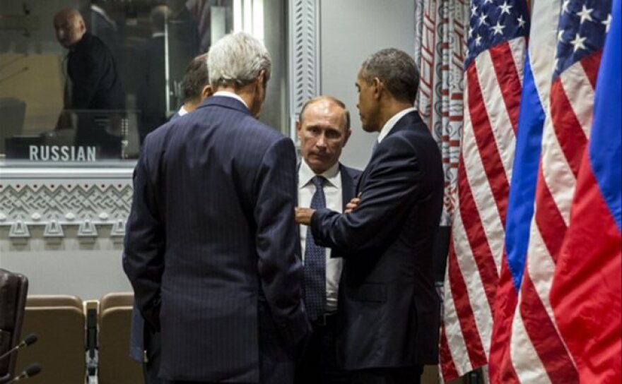 President Obama talks with Russian President Vladimir Putin and U.S. Secretary of State John Kerry during the 70th United Nations General Assembly Sept. 28, 2015.