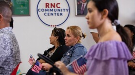 Latinos listen to GOP speakers aiding them with U.S. citizenship instruction at a Republican National Committee (RNC) community center in Doral, Florida — the sort of on-the-ground Latino engagement critics say Democrats don't enough of in the state today.