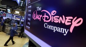 In this Monday, Aug. 7, 2017, photo, The Walt Disney Co. logo appears on a screen above the floor of the New York Stock Exchange. (Richard Drew/AP)