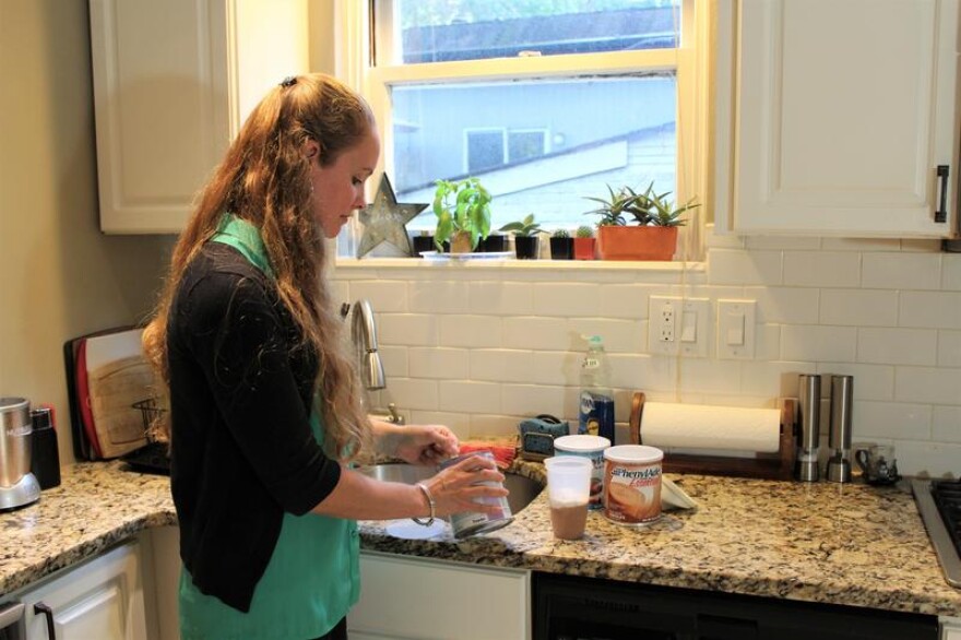 Amanda Moller prepares her formula in her home in University City, Missouri. The formula is vital to treat a rare condition, but her insurer doesn't cover it.