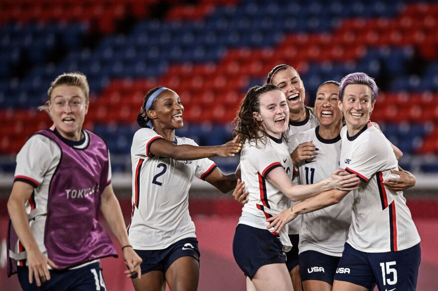 The U.S. team celebrates after winning the Tokyo 2020 Olympic Games women's quarter-final soccer match between Netherlands and the U.S. on July 30, 2021.