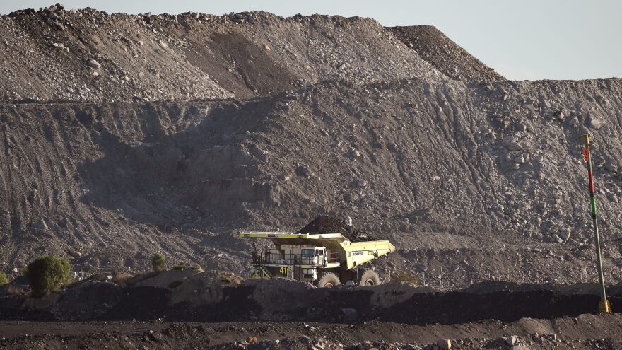 A large truck driving trough an open-cut coal mine in Singleton in the Hunter Valley north of Sydney as Australia, in 2015.