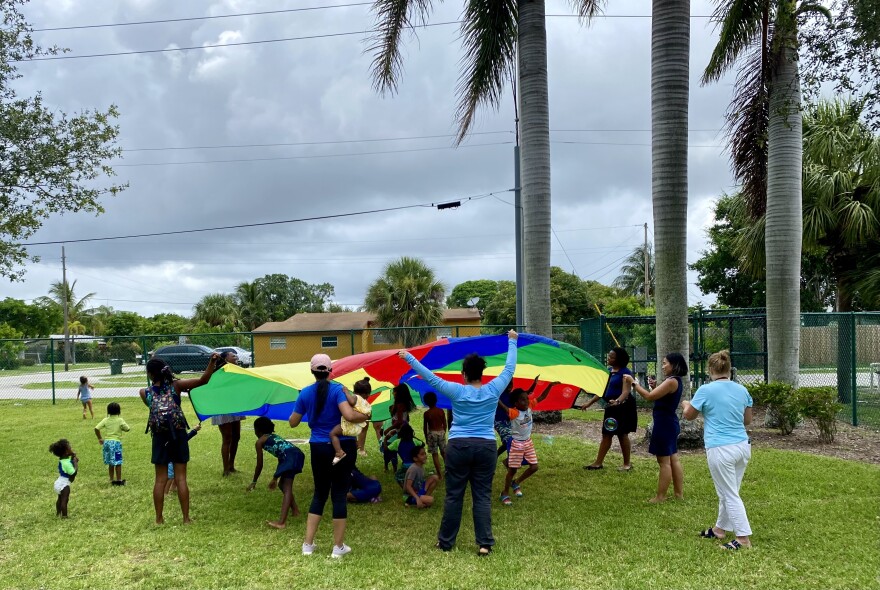 Librarians lead various activities before reading with children at the Catherine Strong Park for the new Library On The Go program, hosted by the Delray Beach Public Library.