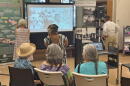 Kunmi Yu Danico, the director of the UH Center for Oral History, talks with Maui women during the Oral Histories of Maui event in Wailuku on July 20, 2026.