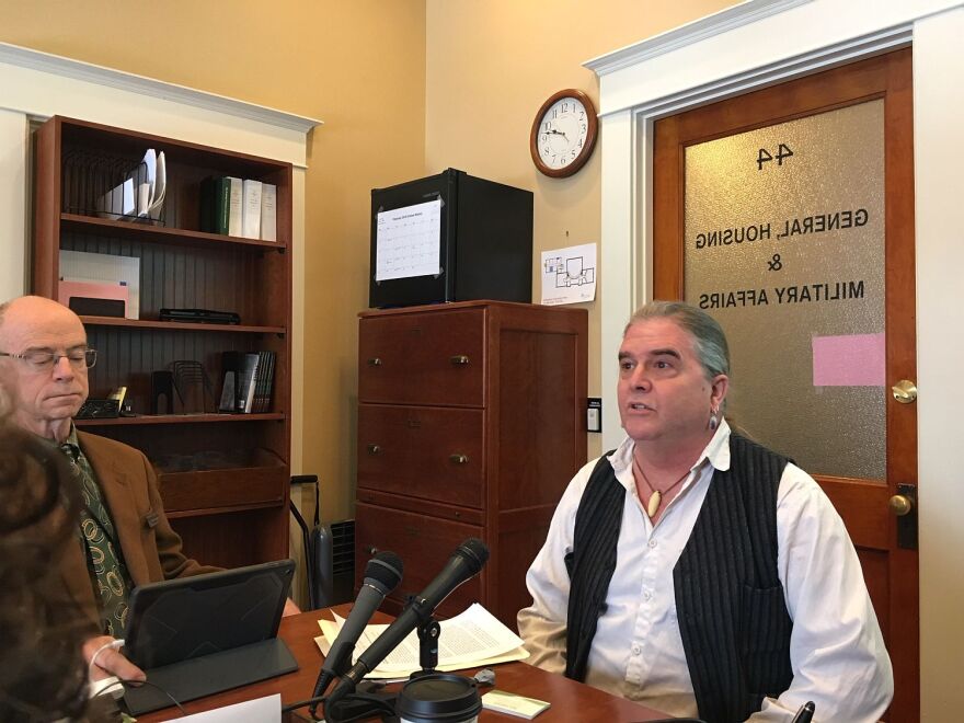 A man sits in a office.