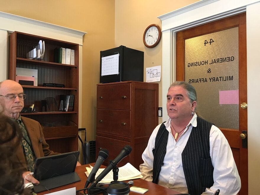 A man sits in a office. 