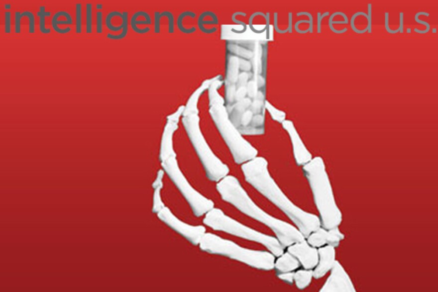 skeletal hand clutching a pill bottle and the intelligence squared logo