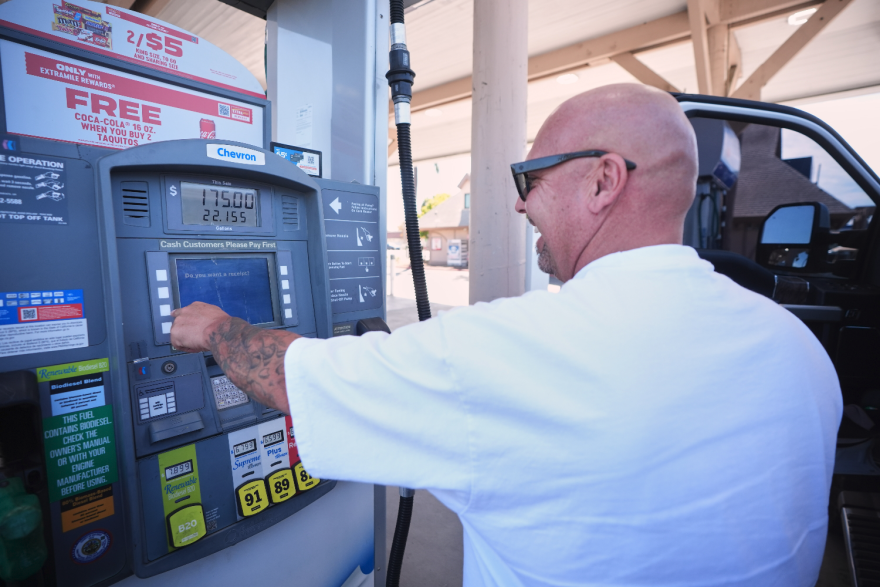 A man getting gas answers a "do you want a receipt?" prompt on the screen. The total price was $175 for about 22 gallons.