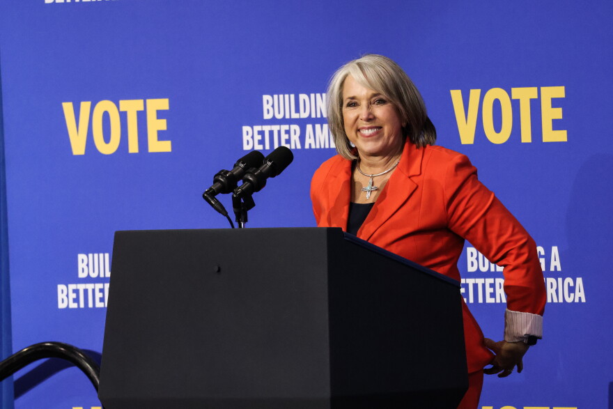 Governor Michelle Lujan Grisham smiles at supports as she took the stage during Thursday's rally