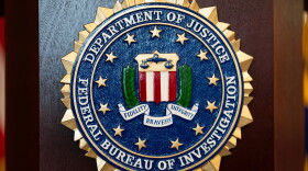FILE - An FBI seal is displayed on a podium before a news conference at the field office in Portland, Ore., Jan. 16, 2025.