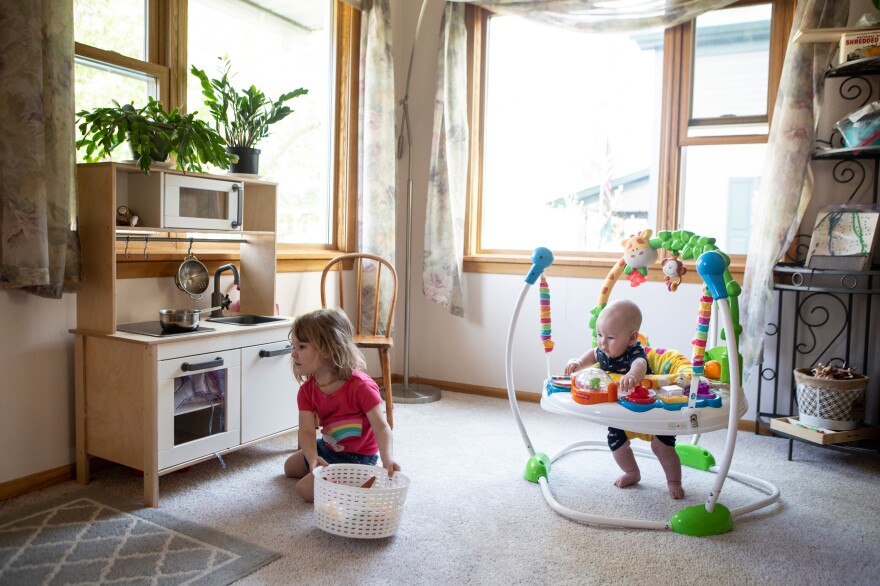 Karli-Rae Kerrschneider's children, Eleanor and Leviathan, play at their home in Baldwin, Wis.