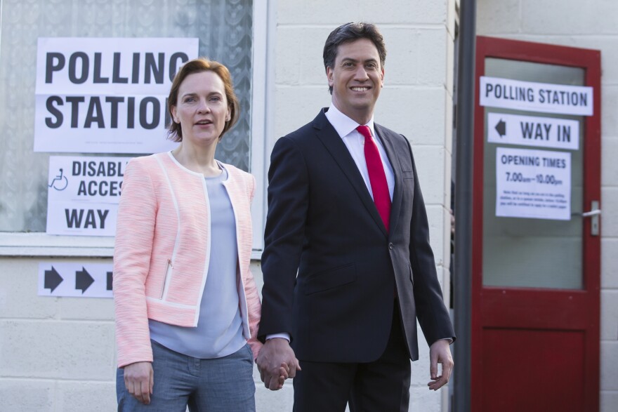 Labour Party leader Ed Miliband and his wife, Justine, leave the polling station after voting at Sutton Village Hall, Doncaster, England, on Thursday.