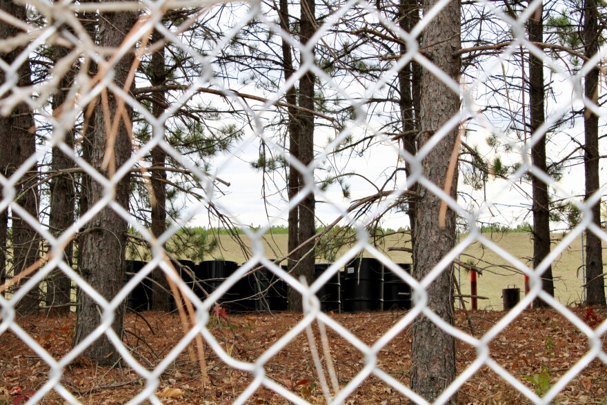 Bins containing hazardous waste sit at the edge of “the vault,” which holds 42,000 cubic yards of contaminated soil and sludge from the St. Regis Paper Co. Superfund Site in Cass Lake, as pictured Oct. 20, 2025.