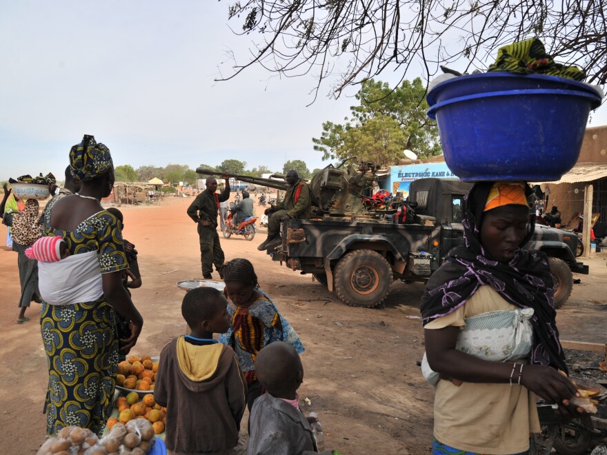 Malian soldiers patrol in Diabaly, Mali on Jan. 22, 2013. Dialaby was one of the places referred to as a "village" on NPR.