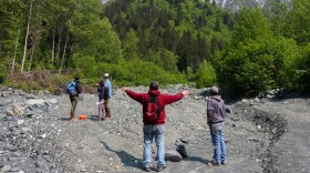 Chilkat Indian Village environmental staff and outside researchers stand on the 23 mile slide area during a site visit in June.