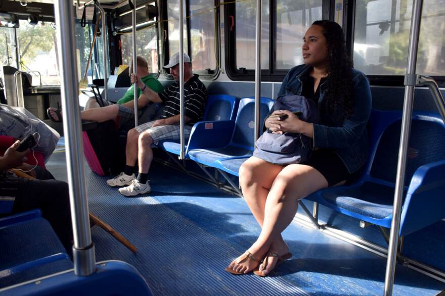 Gaustria (right) takes the bus from her home in East Gainesville to Bo Diddley Plaza, where she spoke for Transgender Day of Remembrance.