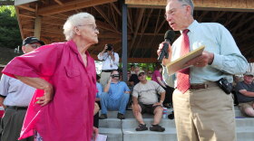 Sen. Chuck Grassley (R-IA) responds to a question from Sheryl Prather at a town meeting in Adel, Iowa. Facing heat from conservative constituents, the senator has backed away from bipartisan health care negotiations.