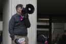 A protester with a megaphone outside the Eugene Federal Building, Jan. 30, 2026.