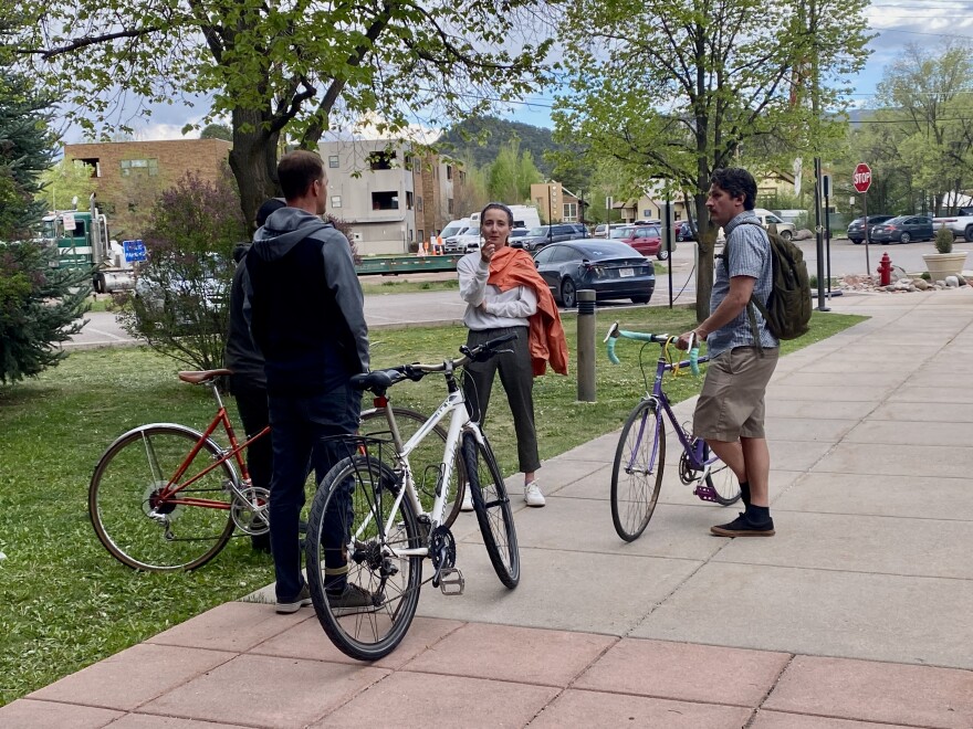 We-Cycle staff chat after the presentation with their respective bicycles.