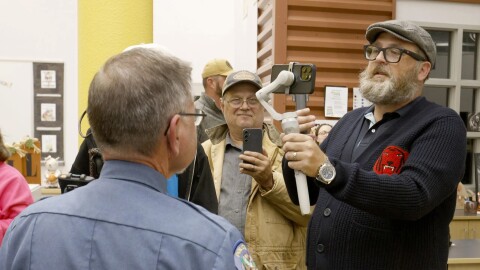 Coweta Police Chief Mike Bell chats with YouTuber Ron Durbin after the Coweta School Board meeting on Nov. 10. Durbin was attempting to conduct a citizen's arrest after someone allegedly touched his son/cameraman during the event.