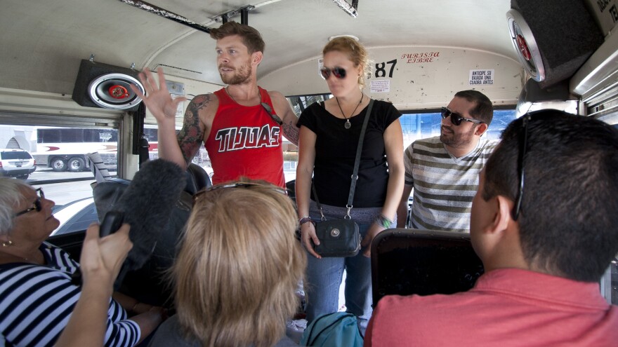 Derrik Chinn introduces two Mexican artists to the tour group: Gloria Muriel (Glow) and Alonso Delgadillo (El Norteno).