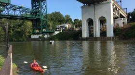 Tyler Middendorf is the first kayaker to arrive at Merwin's Wharf in Cleveland at the end of a 50-mile, two-day journey up the Cuyahoga River for the 5th Annual Crooked River Commute.