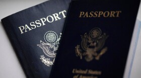 FILE - U.S. passports are arranged for a photograph in Tigard, Ore., Dec. 11, 2021. (AP Photo/Jenny Kane, File)