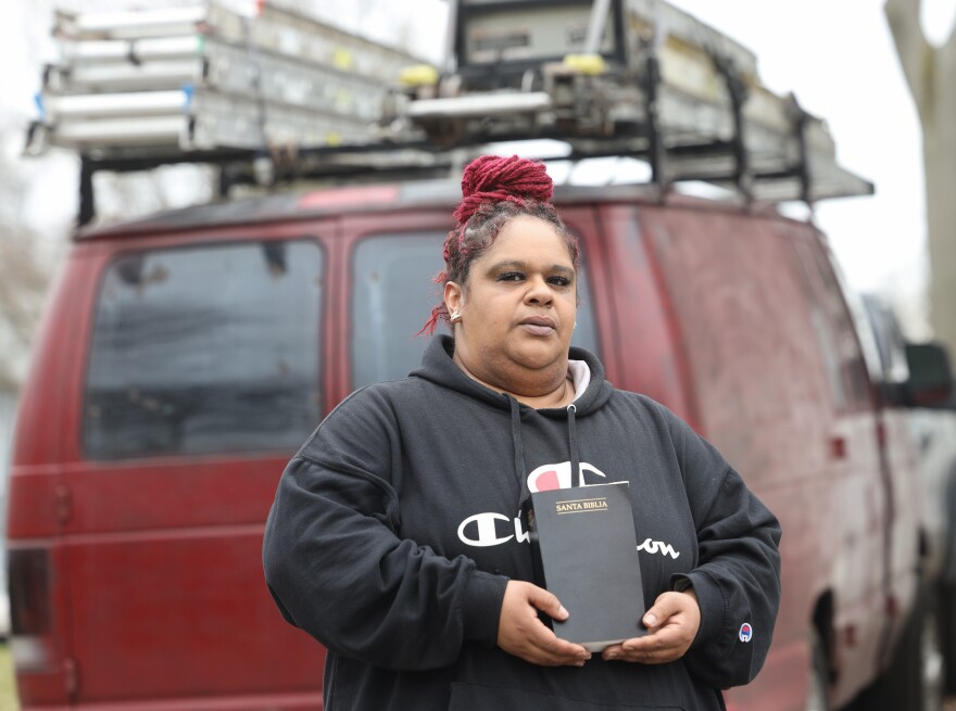 Sarah Galvan holds the Spanish language Bible that her husband kept on the dashboard of his work van. Galvan's husband and two stepsons who were pulled over by federal immigration agents on Monday, March 24, 2025, and detained with assistance from Rochester police.